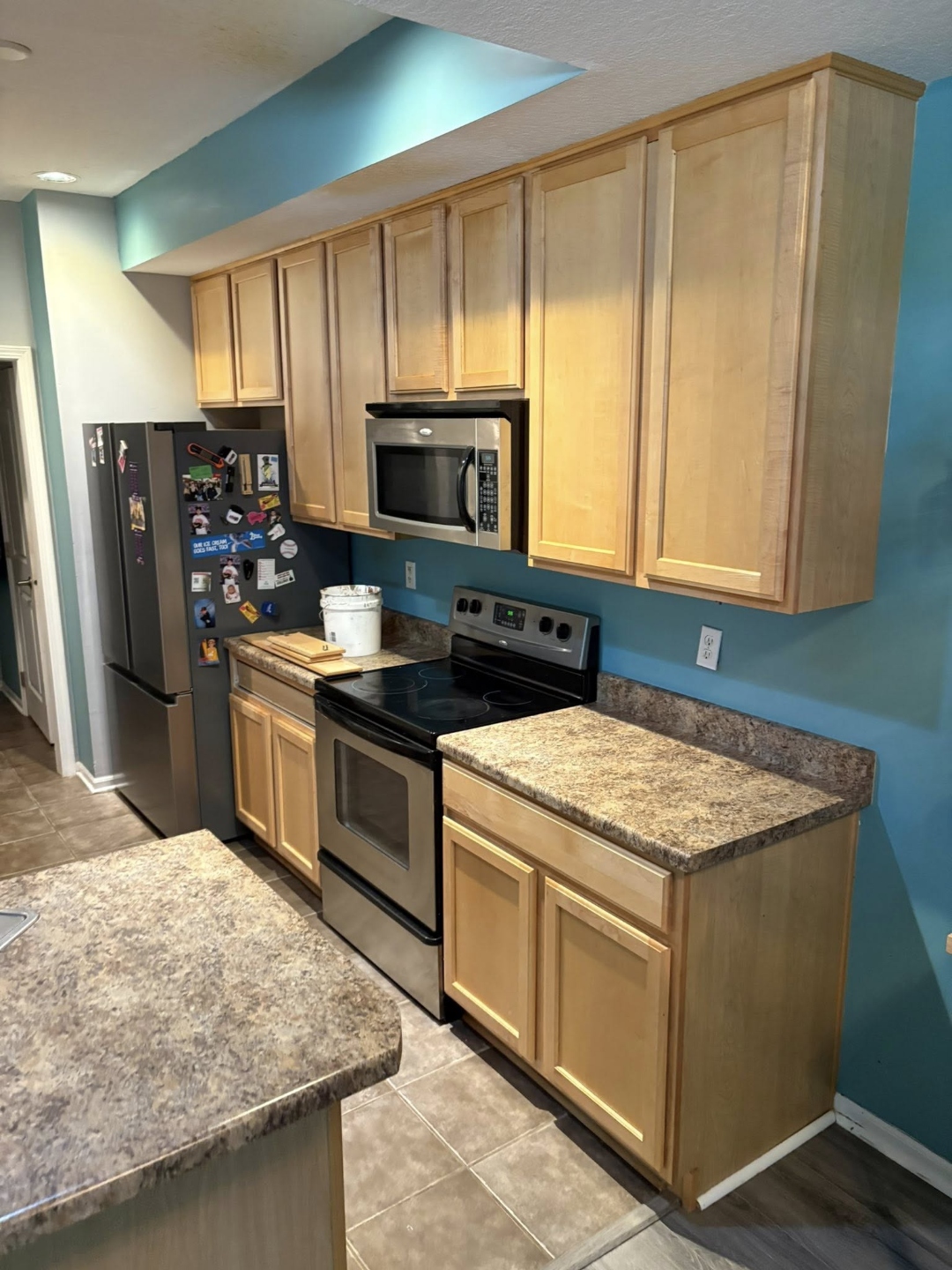 Kitchen before — original cabinets